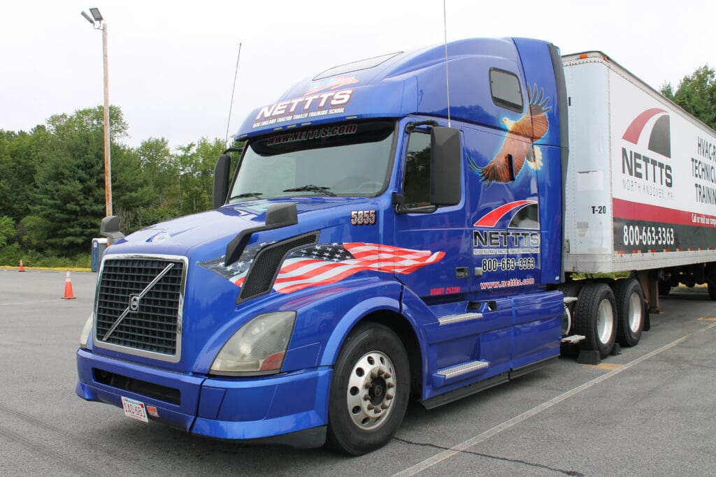 A NETTTS semi with an American flag and eagle painted on it