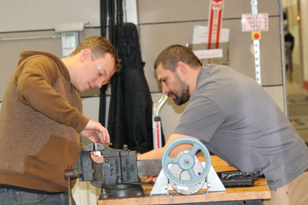 Two HVAC students working on equpment