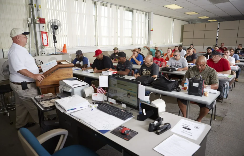 A CDL classroom with an instructor at the front and students at desks