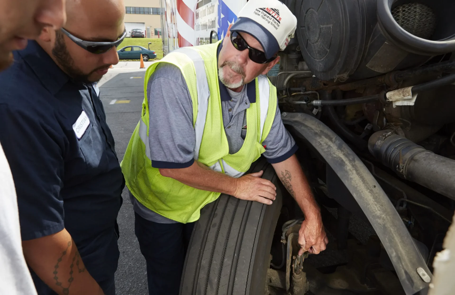 nettts-cdl-instructor-scaled A CDL instructor showing students parts of a semi